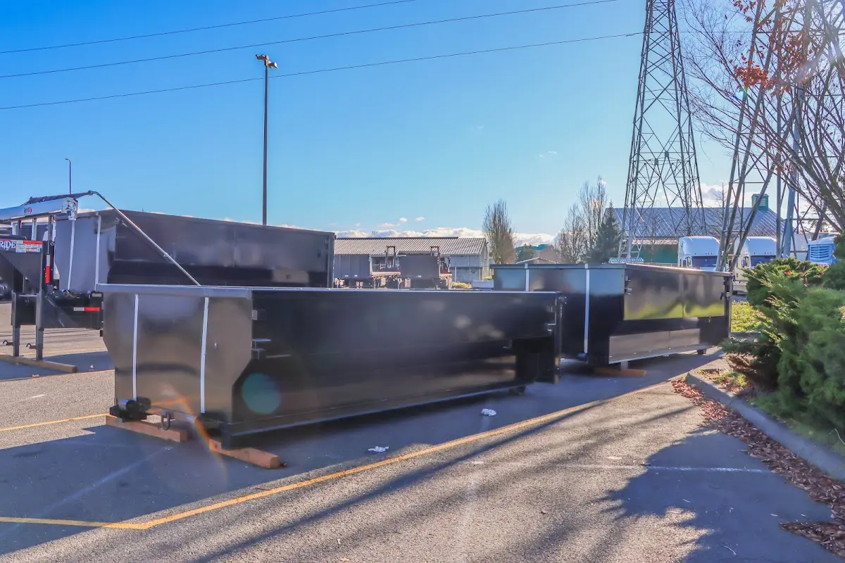 Roll-off dumpster ready for waste disposal at job site for Demolition Dumpster Rental in Eatonton